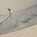 Mark heads down a dune